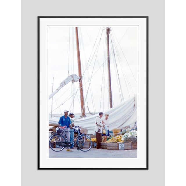 Nassau Fruit Stall by Toni Frissell Tourists browse a fruit stall at the harbours edge in Nassau, Bahamas, 1968. (Toni...