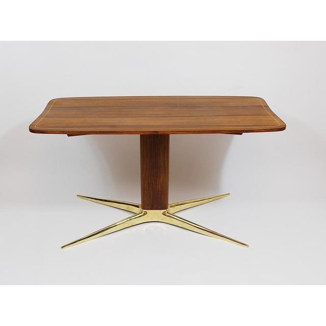 An elegant coffee or sofa table from the 1950s, designed by the Austrian architect and designer Oswald Haerdtl. A...