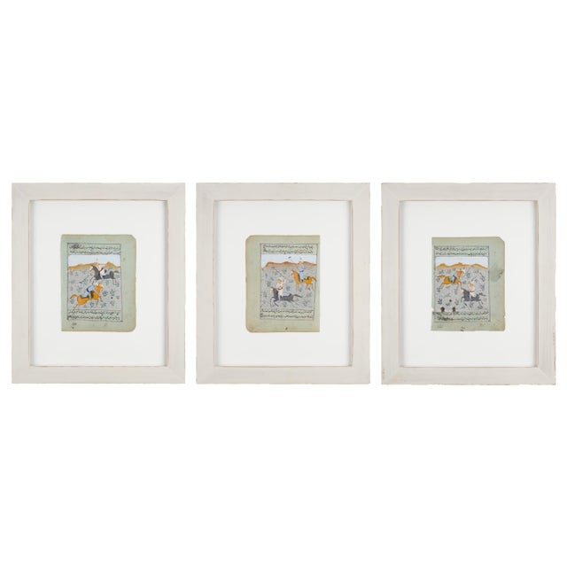 A charming set of three antique Persian miniature paintings depicting chovgan — the ancient sport of Persian polo —...