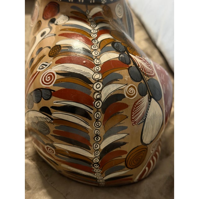 1960’s Tonalá handmade red pottery large recumbent feline with intricate patterns and designs featuring flowers and...