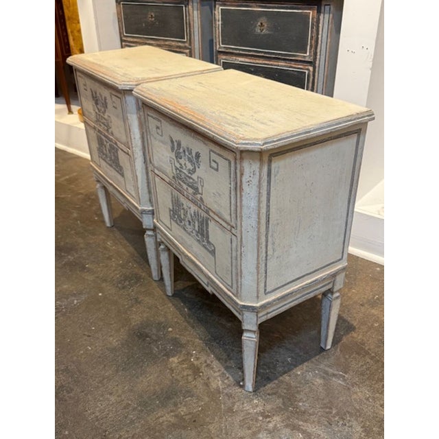 Pair of German hand painted Neo-classical bedside tables. A pair of German Neo‑Classical bedside tables is a fantastic...