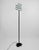 A Postmodern floor lamp of great charm, made in Italy by the historic lighting company Arteluce founded in 1939 by Gino...