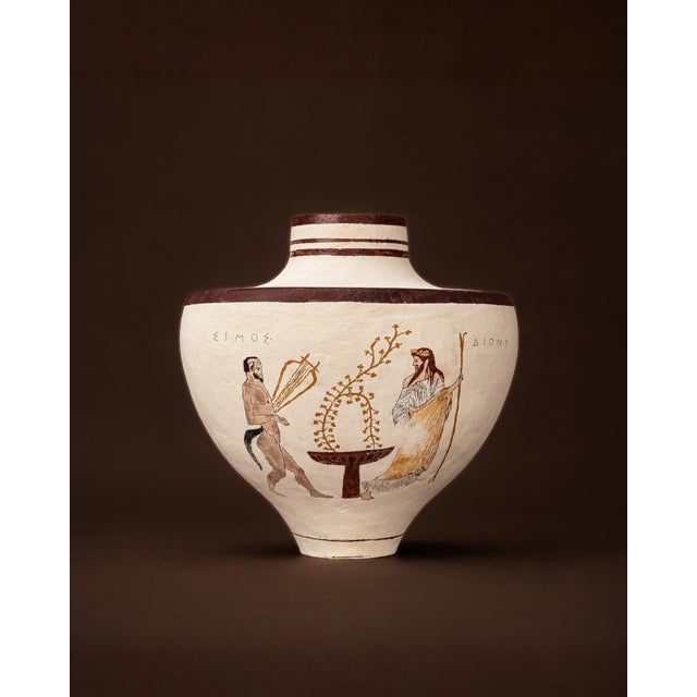 This amphora references classical Greek iconography through a dual narrative approach. One side presents Hermes offering...