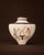 This amphora references classical Greek iconography through a dual narrative approach. One side presents Hermes offering...