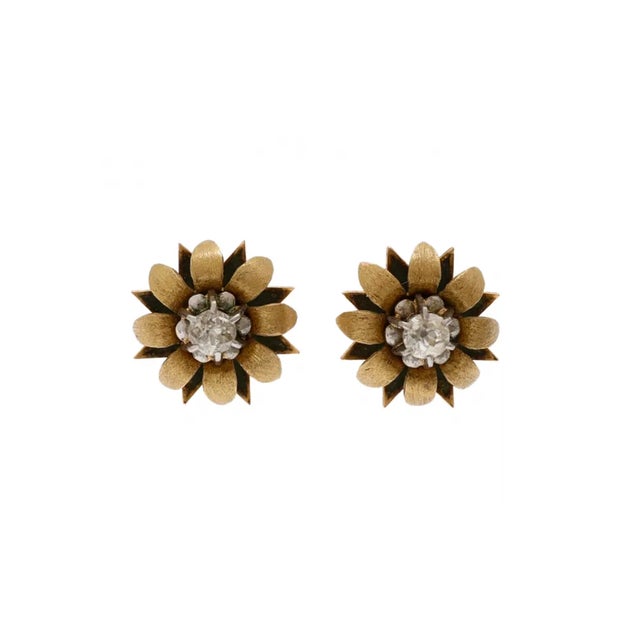 18k gold earrings in the shape of flowers with centrally set diamonds of a total weight of about 0.60 ct (color H-I purity...
