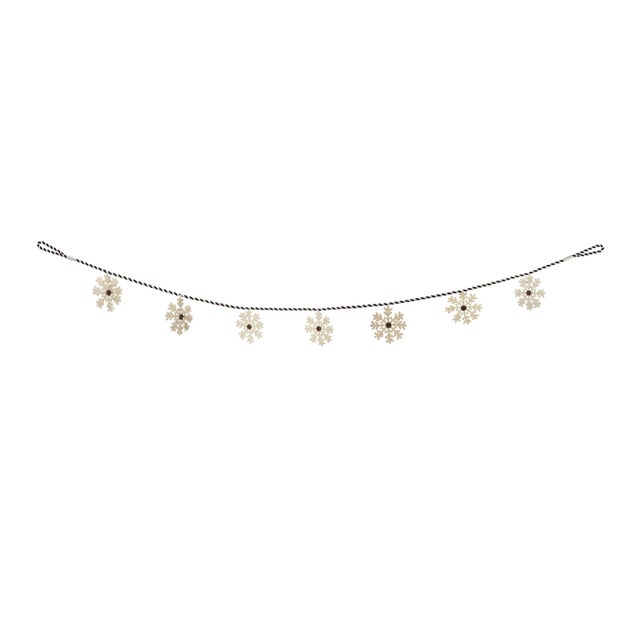Bring a touch of winter magic to your home with our Fabric Snowflake Garland Set. Crafted with a perfect blend of black...