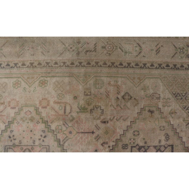 Measures: 5'10 x 9'11. This vintage Turkish Oushak rug features a unique blend of colors and an intricately beautiful...