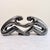 A bold Haeger abstract sculpture in the iconic black and silver marbleized glaze, depicting two interlocking figural forms...