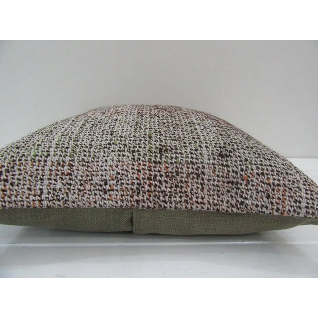 This is a pillow cover made from a vintage kilim rug. The piece was properly washed and ready to use. Pillow inserts not...