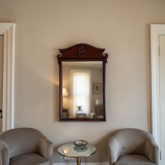 Traditional Colonial Revival or Chippendale-inspired (popular in American furniture from the 1920s–1960s), with strong...