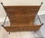 Bring timeless Mid-Century Modern style to your home with this vintage magazine rack featuring a sturdy black iron frame...