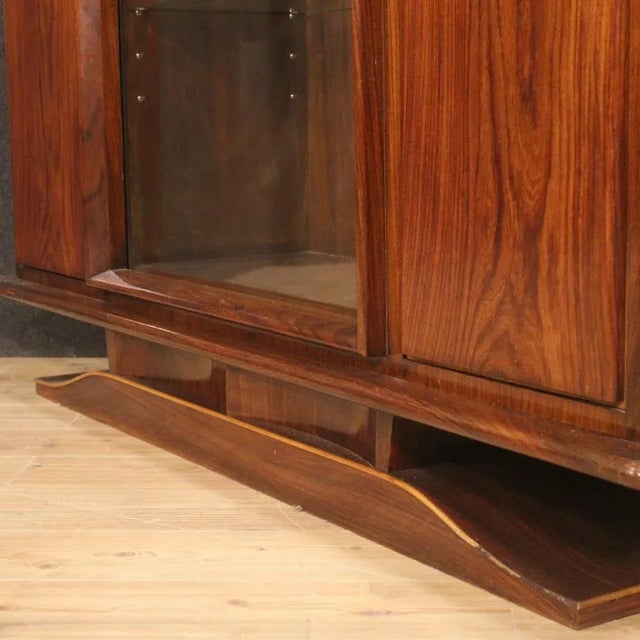 Italian vitrine from the mid-20th century. High quality furniture in rosewood, palisander, mahogany, walnut, maple and...