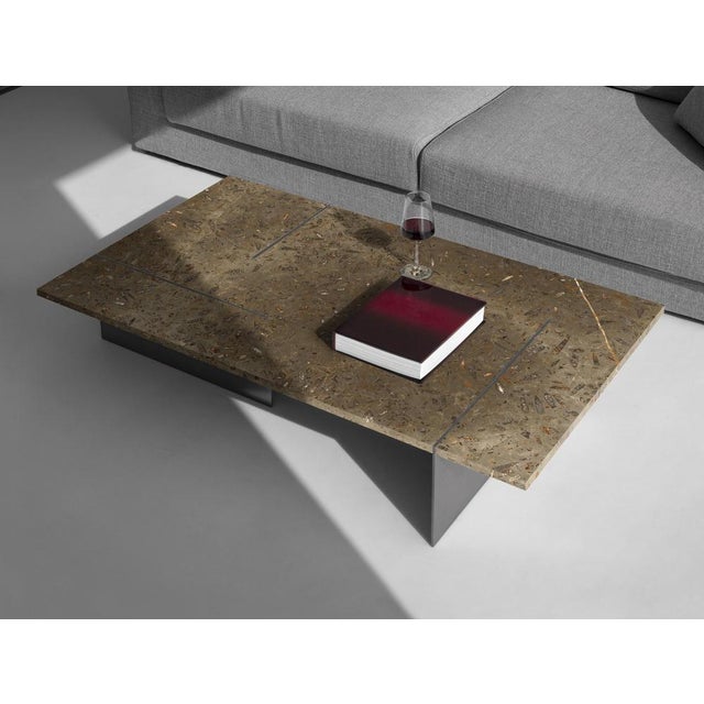 Memoria coffee table in jurassic fossil stone by nerinea. Dimensions: w 75 x d 130 x h 25 cm. Materials: natural stone...