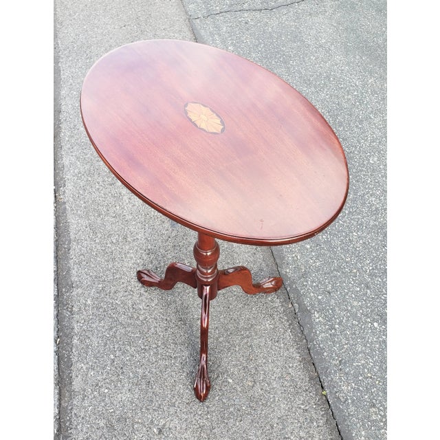 Mahogany Inlaid Tilt-Top Tea Table Side Table with Tripod claw Feet in very good vintage condition. Table measures 26.5"...