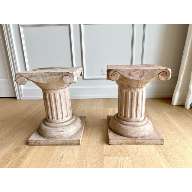 Architectural, sculptural, and endlessly versatile, this pair of vintage carved wood side tables transforms one of...