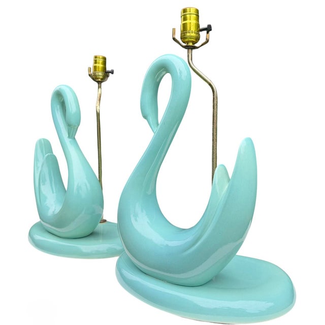 Graceful and sculptural, this pair of vintage aqua swan lamps captures the playful sophistication of mid-century design....