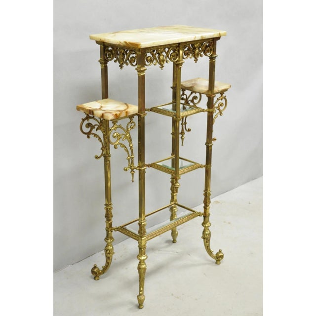 Antique Victorian Brass & Onyx Ornate Tiered Etagere Curio Display Stand Shelf. Item features an ornate brass frame, onyx...