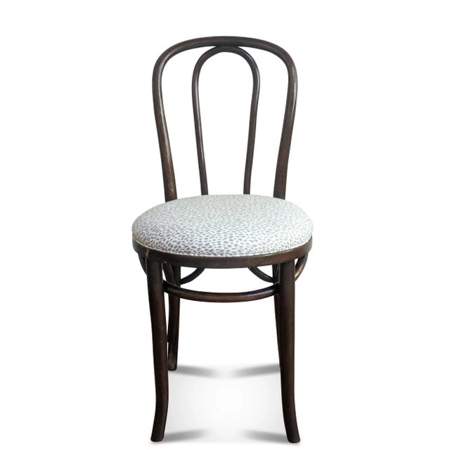 A vintage bentwood cafe chair we have reupholstered in an animal print fabric. The bistro chair was made in the former...