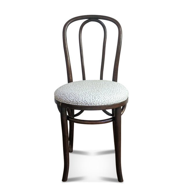 A vintage bentwood cafe chair we have reupholstered in an animal print fabric. The bistro chair was made in the former...