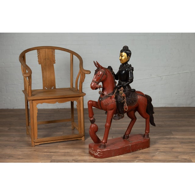 A vintage Burmese polychrome wooden statue from the mid-20th century, depicting a warrior on a horse. Born in Burma during...