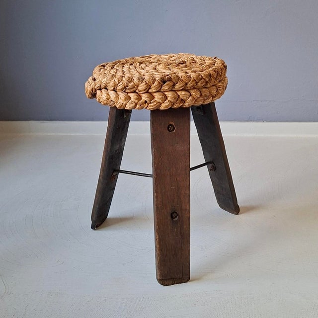 This stool, a design attributed to the French designer couple Adrien Audoux & Frida Minet from the 1950s, features an oak...