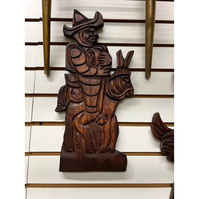 Beautiful hand carved wall hanging. 2 wood wall hangings of Mexican people . On the back it is carved El Salvador. 16.5" x...