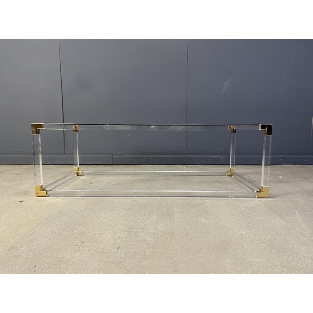 Brass and Acrylic Glass Coffee Table by Charles Hollis Jones, 1970s, in Very Good conditions. Designed 1970 to 1979
