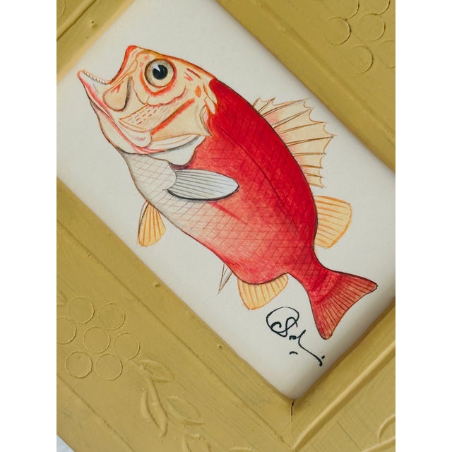 Hand-Painted entirely by hand by our master artists, this piece features a striking red fish with delicate line work, soft...