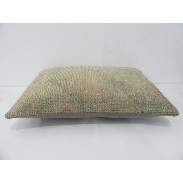Decorative pillow cover made from a vintage Turkish handknotted rug. Backed with good quality cotton fabric. Pillow...
