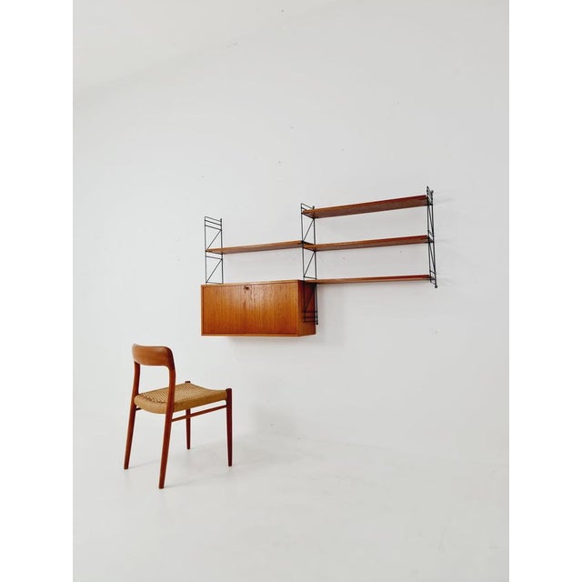 German shelf system by ERBUS West Germany Teak, 1950s Measurements: Height: 94 cm Width: 164 cm Depth: 22 ---30 cm