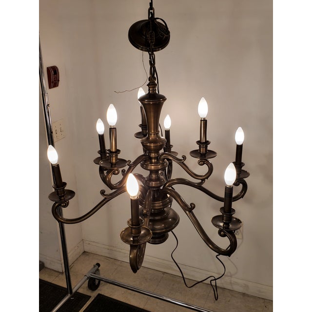 This elegant 8-arm chandelier features a timeless antique bronze finish, making it a perfect addition to both classic and...