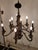 This elegant 8-arm chandelier features a timeless antique bronze finish, making it a perfect addition to both classic and...