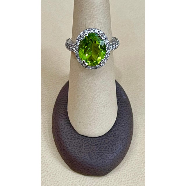 A classic, Cocktail ring 7 Carat of very clean Pear Shape Peridot full of luster and shine and Diamond ring Gold: 14 carat...