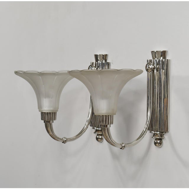 Hubert Petitot & Degué A pair of French steamline art deco wall sconces in nickel plated bronze by Petitot. Made circa...