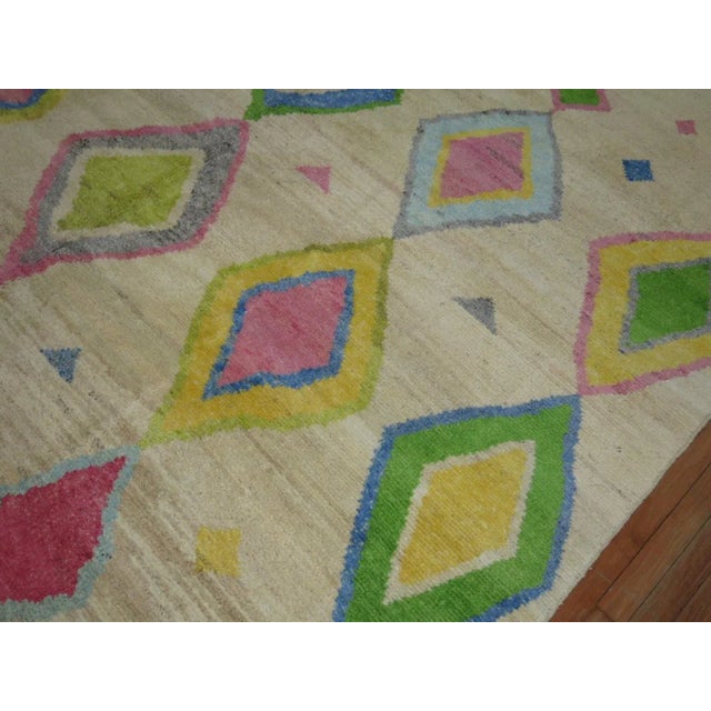 A colorful one-of-a-kind room-size hand-knotted Turkish Tulu rug handwoven with re-cycled wool derived from vintage...