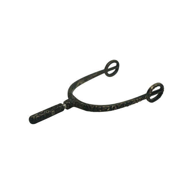 Antique repousse sterling silver equestrian horse spur featuring an ornate floral design with removable screw top. Circa...