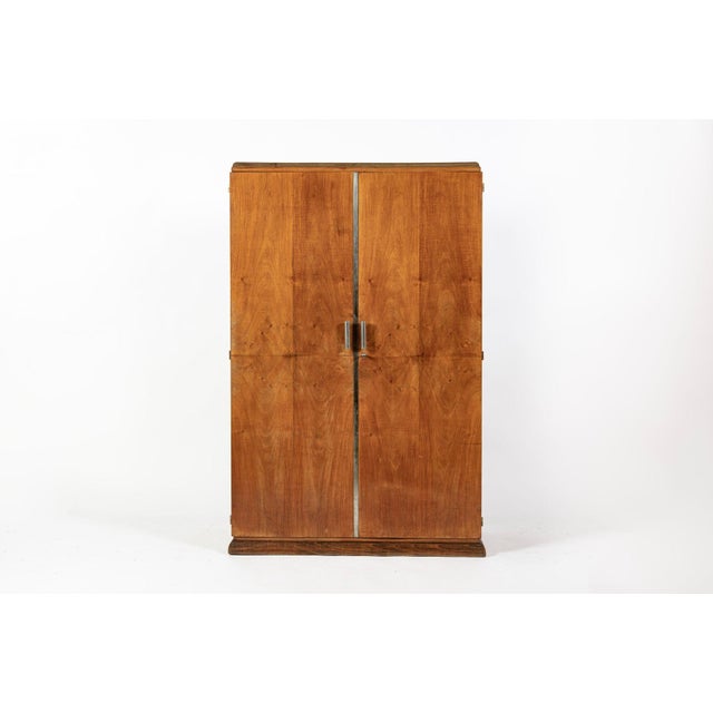 This antique French Art Deco wardrobe armoire was made in France circa 1940. Beautifully handcrafted with mahogany veneer...