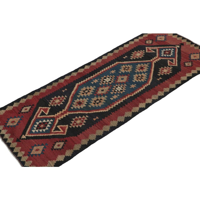 This vintage 4x10 Persian Kilim is believed to be a Ghazvin tribal rug from the titular city and Province in Iran (today...
