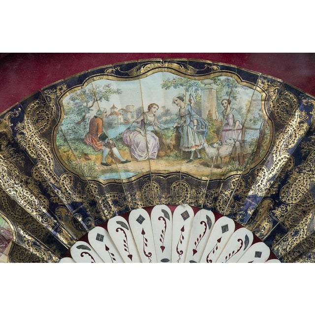 Antique Napoleon III fan made of parchment paper and supported by an ovoriolina frame. The scenes are hand-painted and...