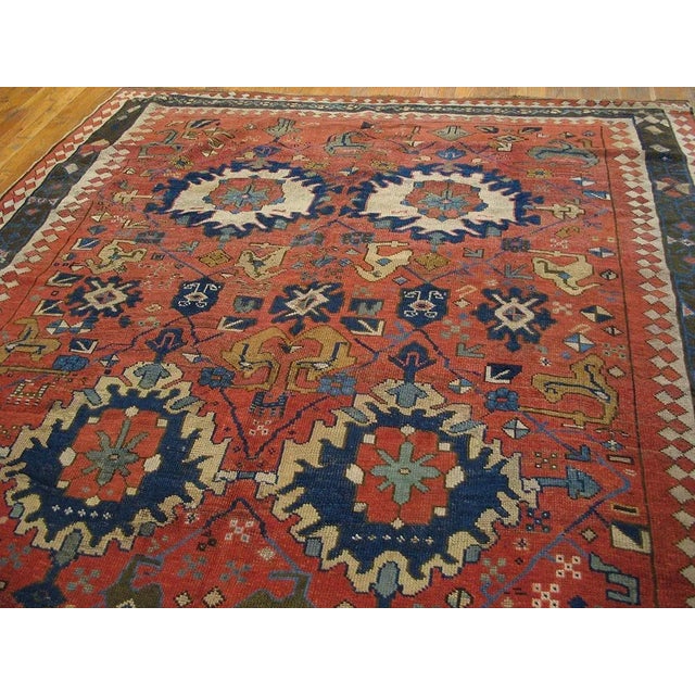Masterly Handmade Red Background With Brown Border Medallion-Crest Design Antique Persian Rug For Sale - Image 4 of 8