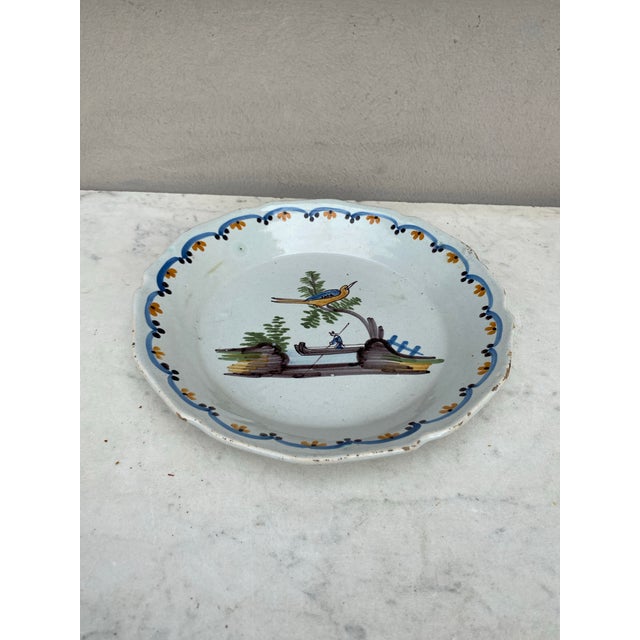 Early 19th Century French Faience Bird Plate Nevers. Bird on a branch , background with a man on a boat. Nevers ( Center...