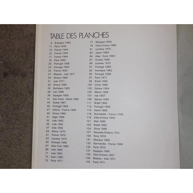 Each of these mid century photographs by famed photographer Edouard Boubat (Fr. 1923-1999) depicts people in everyday...