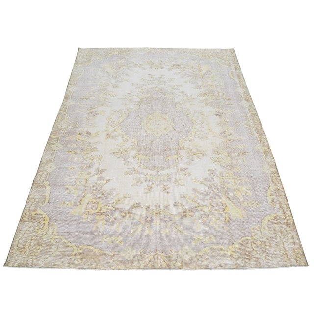 Hand-knotted with care using traditional rug making techniques, this wool rug blends timeless craftsmanship with a modern...