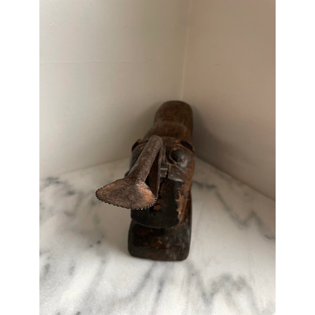 Circa 1900 hand carved hardwood coconut grater. This sculptural early 20th century coconut splitter was likely a...