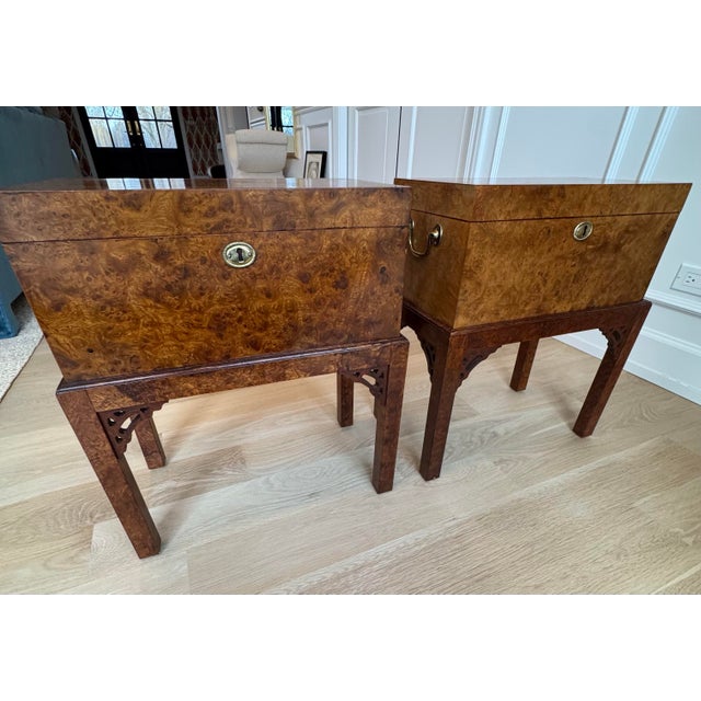 A refined pair of English campaign–style burl wood chests raised on fitted stands, purchased at the Chicago Merchandise...