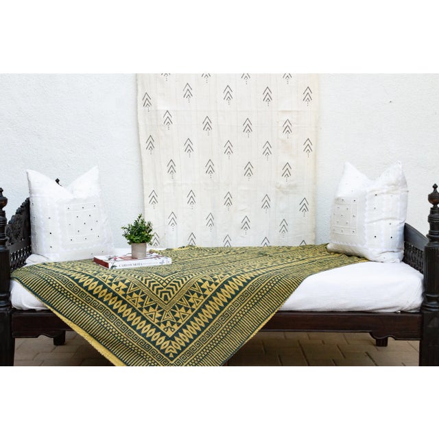 Inspired by traditional Indian kantha quilts, this cotton coverlet features a block-style print of tribal designs and...