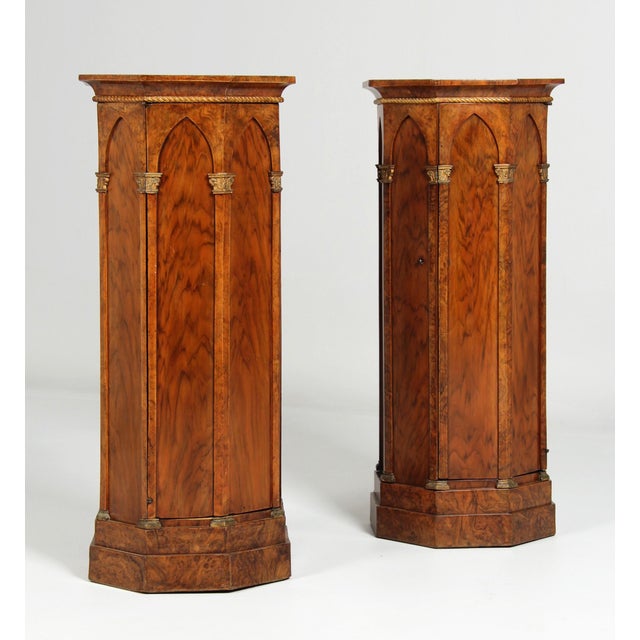 Pair of octagonal column cabinets Central German Walnut, gilded lead casting around 1800 Dimensions: H x D = 89 x 40 cm :...