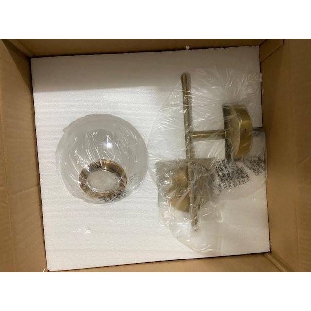 Floor sample, unused pair of Visual Comfort Turenne Sconces in hand rubbed antique brass with clear glass globe. The pair...