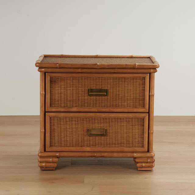 Pair of vintage British Colonial style two drawer stands with organic appeal crafted with faux bamboo frames and woven...