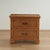 Pair of vintage British Colonial style two drawer stands with organic appeal crafted with faux bamboo frames and woven...